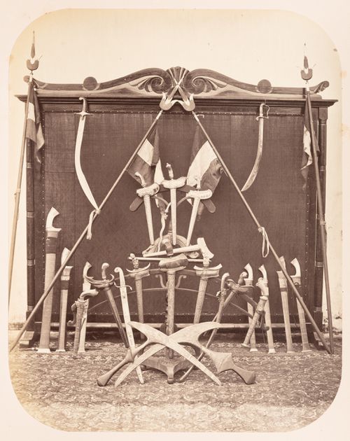 View of a display of weapons belonging to the Regent of Bandong (now Bandung), Bandong (now Bandung), Dutch East Indies (now Indonesia)