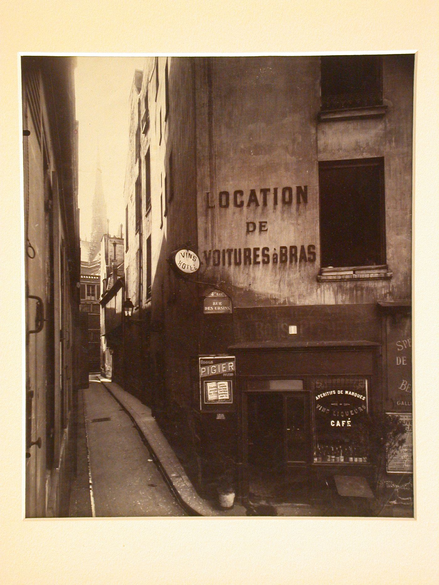 View down rue de Chantres, with spire of Notre-Dame de Paris in distance, Paris, France