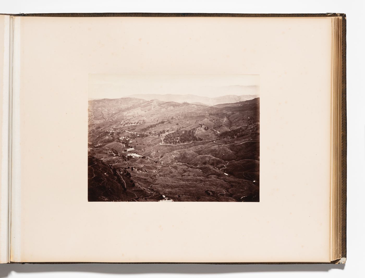 View of plantations, hills and buildings, Pussellawa, Ceylon (now Sri Lanka)
