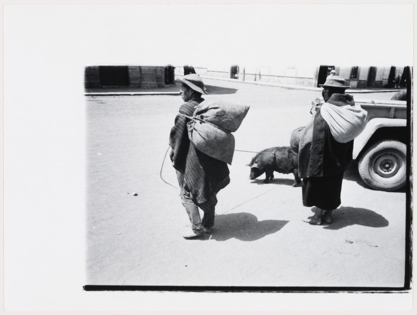 People with pig on a leash, South America