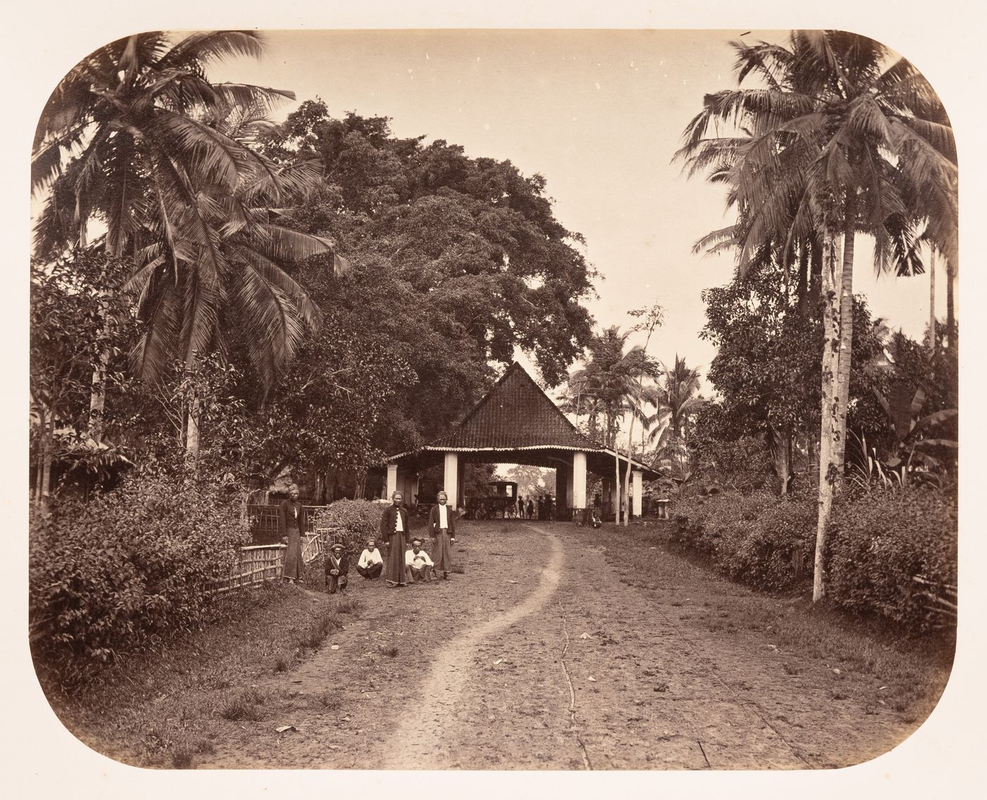 View of a road, a pavilion-like building and people, near Tjiandjur (now Cianjur), Dutch East Indies (now Indonesia)