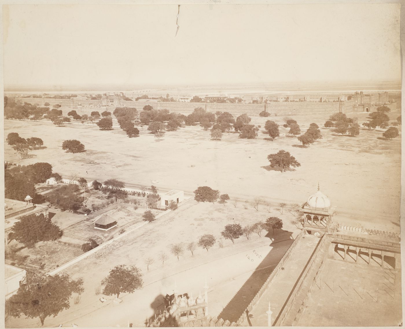 View of Delhi showing part of the Jumma Masjid complex, open spaces and the Shahjahanabad (now Lal Qila or Red Fort) in the background, Delhi, India