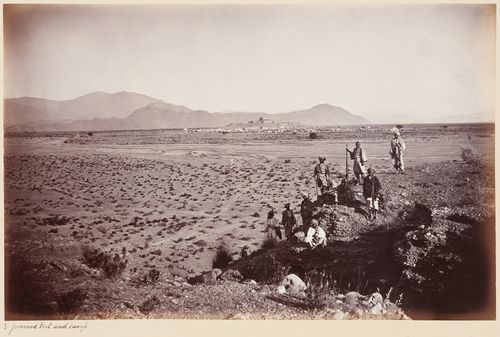 Distant view of Jamrud Fort, a British military camp and mountains with men in the foreground, Jamrud, India (now in Pakistan)
