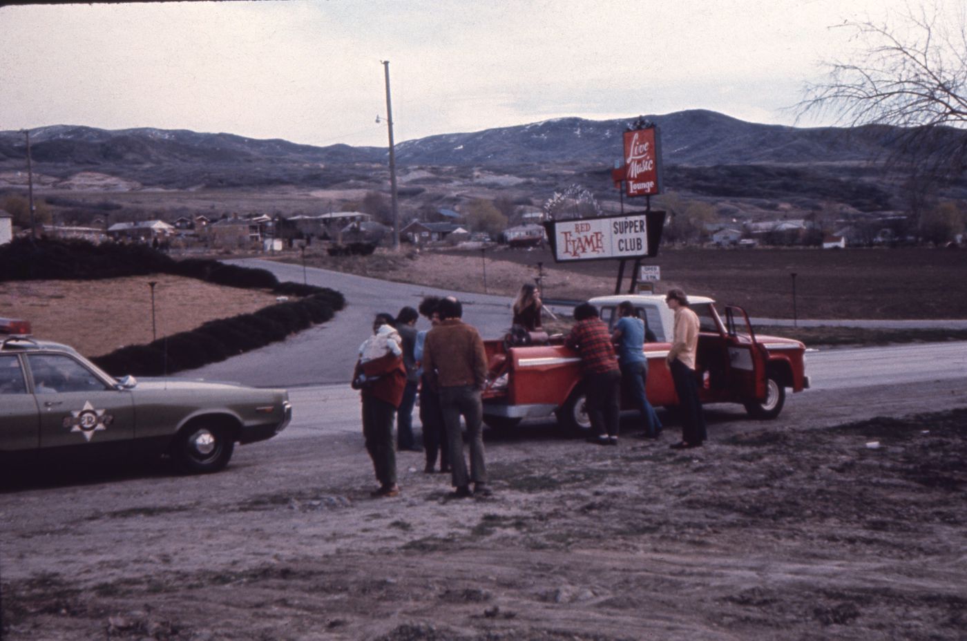 Slide of truck and police car at the side of the road for Red Line