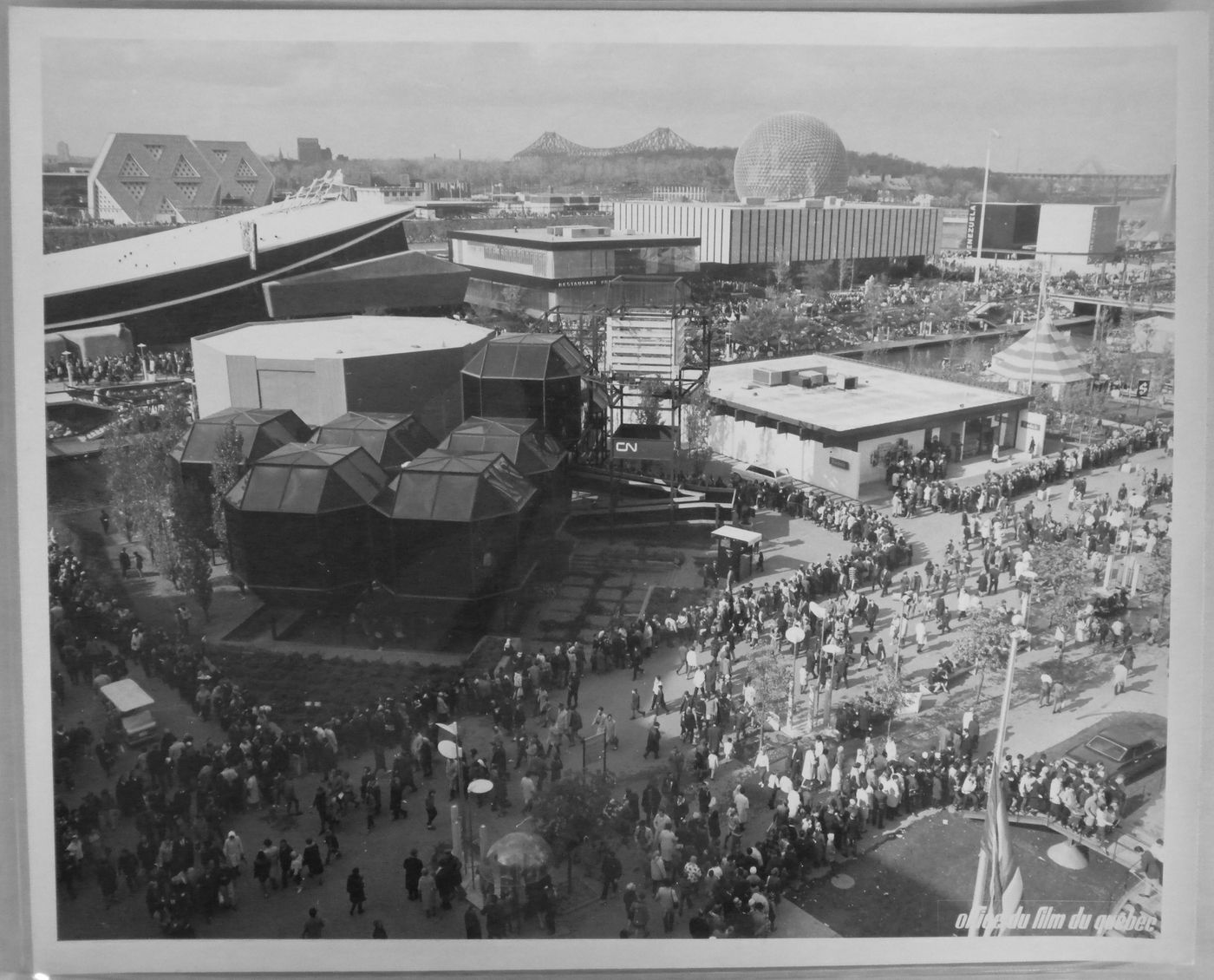 View of visitors standing in line on the Île Notre-Dame site, Expo 67, Montréal, Québec