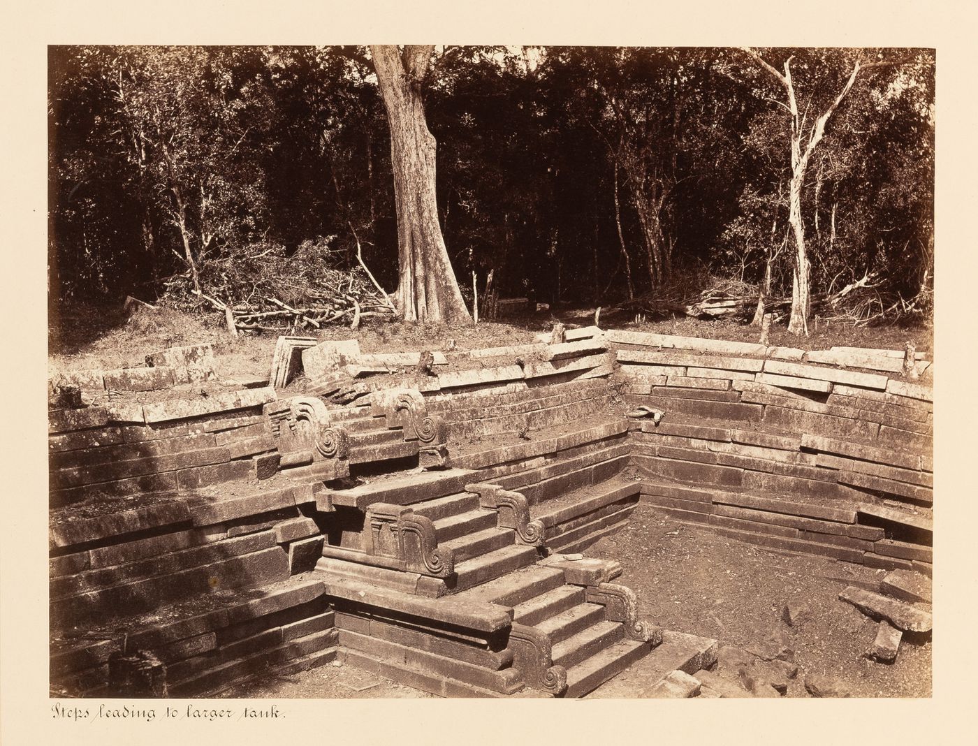 View of a staircase leading into a water tank, Kuttam Pokuna [Twin Ponds], Anuradhapura, Ceylon (now Sri Lanka)