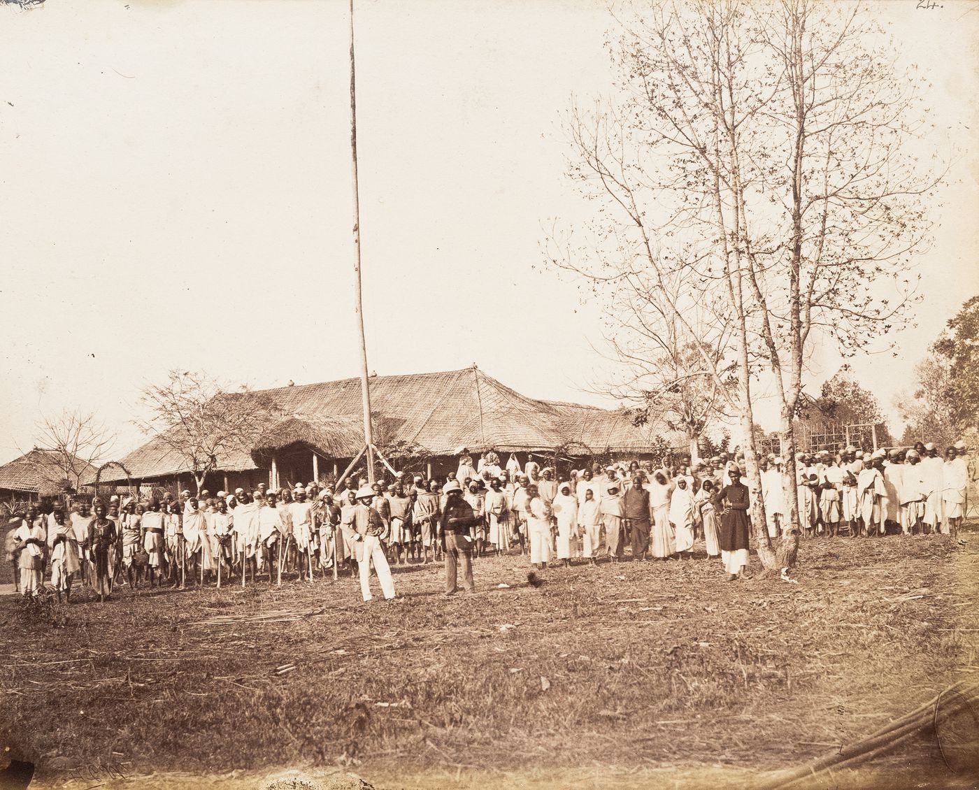 View showing activities in front of a shed in a village, Cachar, India