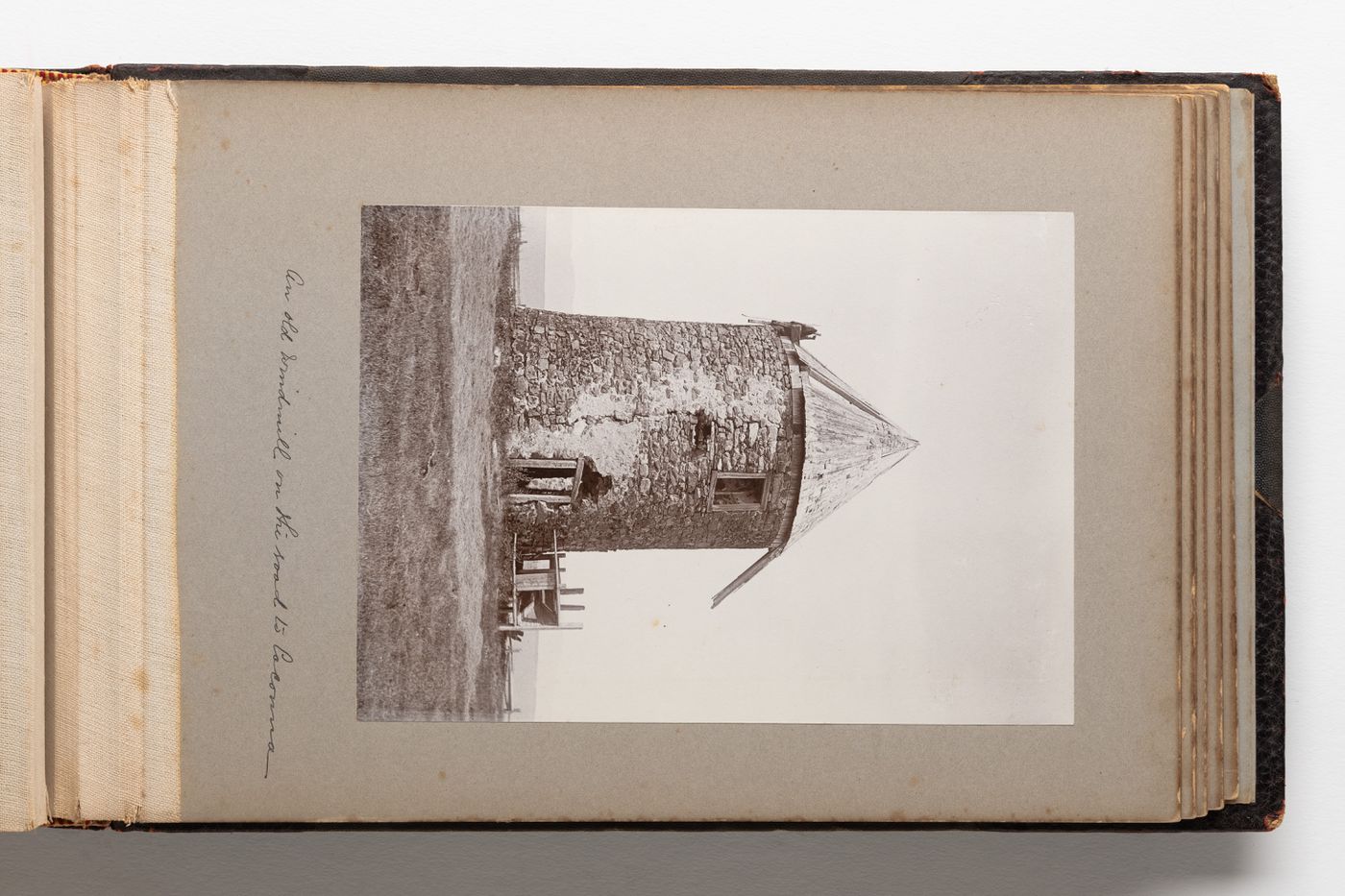 View of a round stone structure identified as a windmill in a field, Quebec, Canada