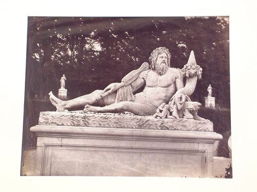 Tuileries Gardens, view of a reclining male god, carved in stone, Paris, France