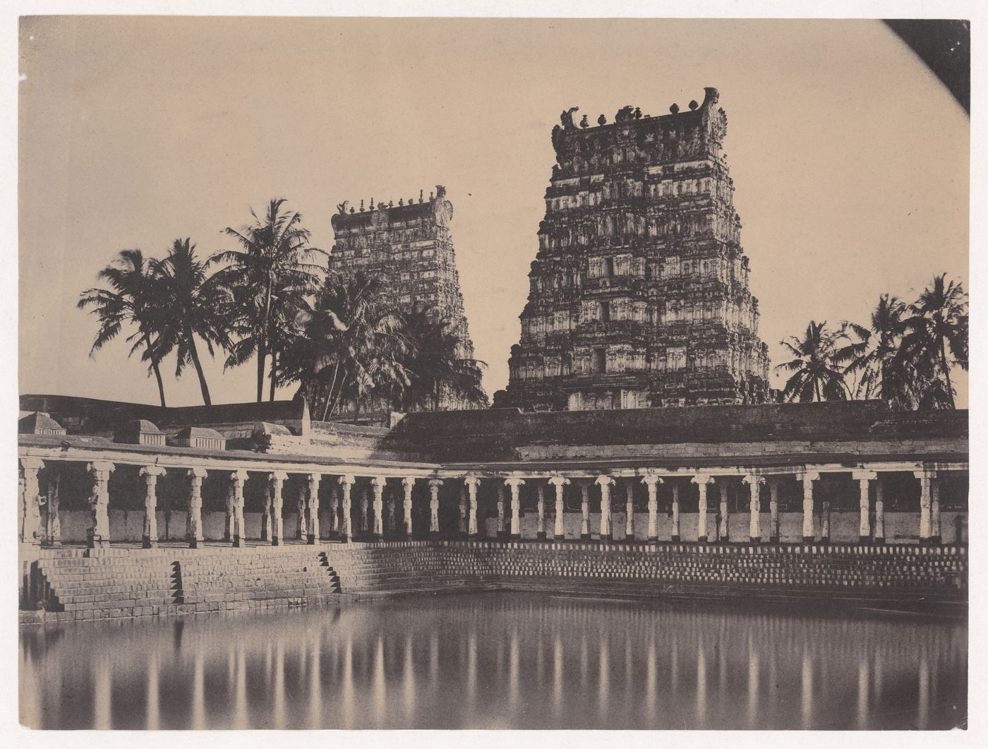 View of the Tank of Golden Lilies with the eastern gopuras in the background, Minakshi Sundaresvara Temple (also known as the Great Temple or Pagoda), Madura (now Madurai), India