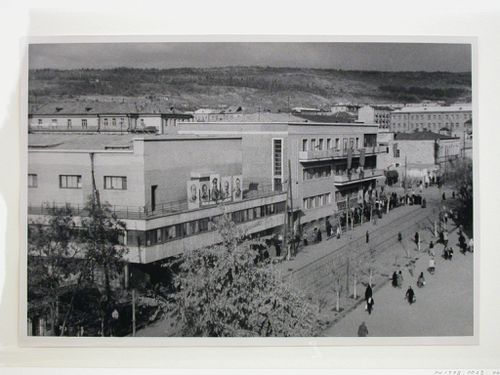 Exterior view of the Club for Construction Workers showing portraits of Lenin, Stalin, and other Soviet political leaders, Yerevan, Soviet Union (now in Armenia)