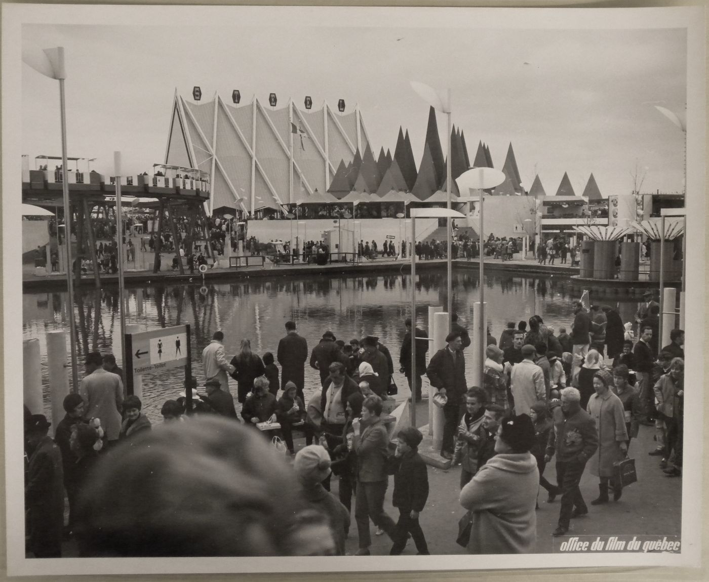 View of a waterway next to the Steel and Canadian Pulp and Paper Pavilions, Expo 67, Montréal, Québec