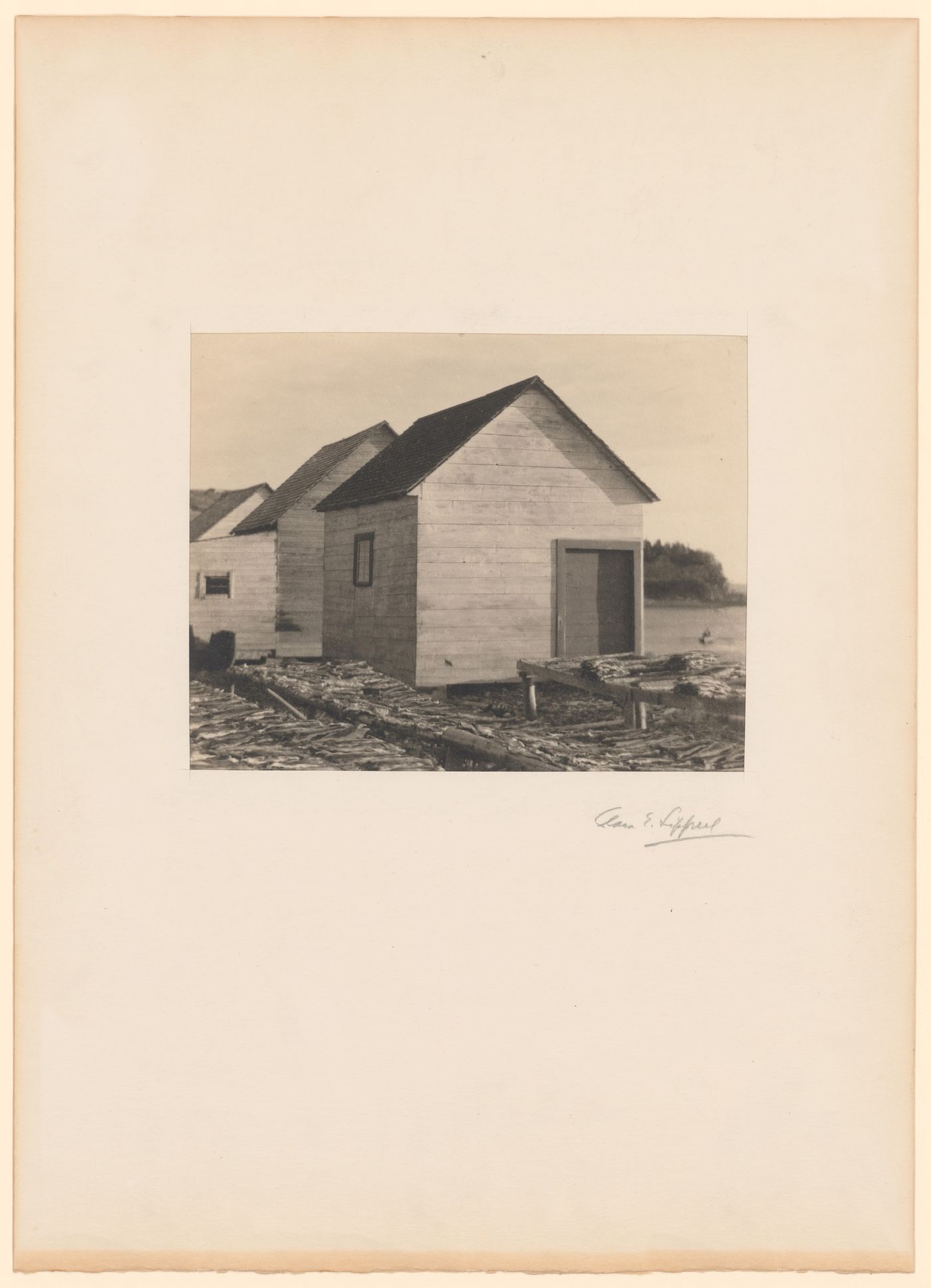View of sheds and codfish drying on racks, Gaspé Peninsula, Québec, Canada