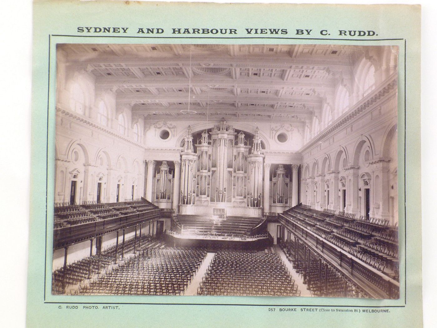 Interior view of a concert hall from the gallery showing the stage and the organ, Sydney [?], Australia