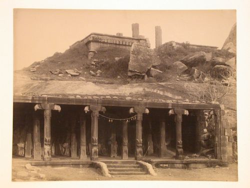 View of a columned entrance to a temple or a hypostyle hall, also showing ruins of a temple above, India