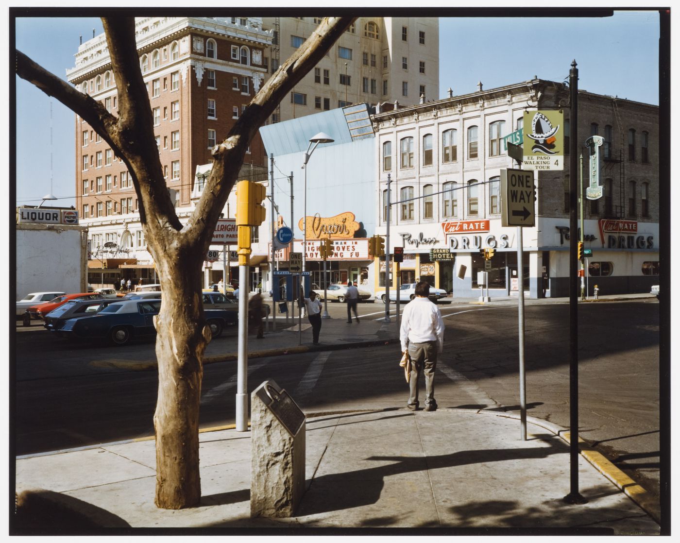 View of a man standing at a cross walk, El Paso St., El Paso, Texas
