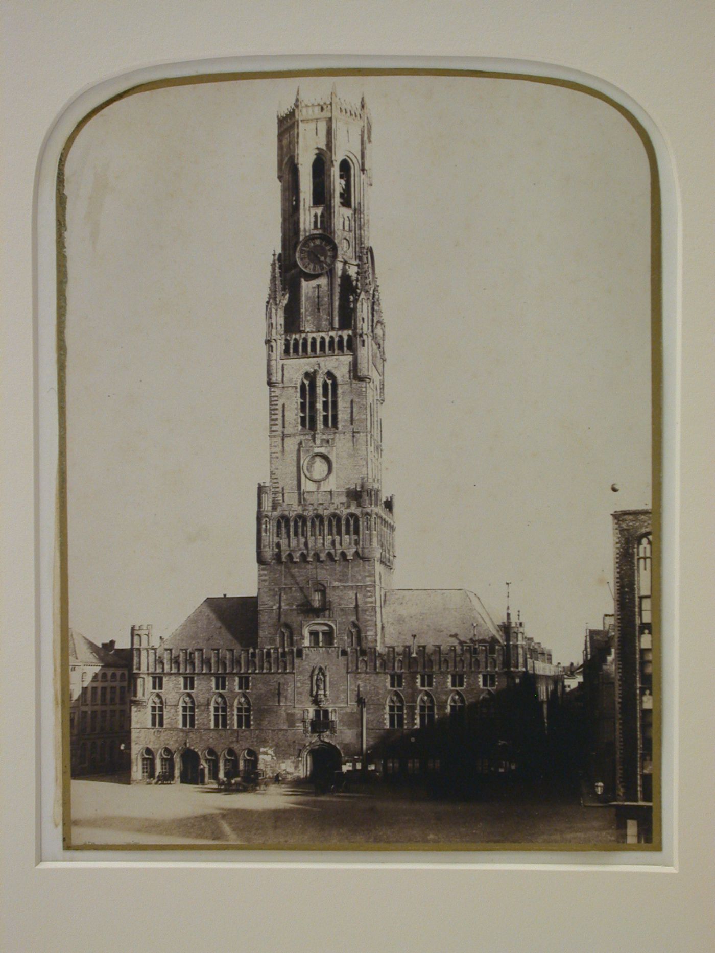 Exterior view, façade of large building with tall clock tower, possibly a town hall, Bruges, Belgium