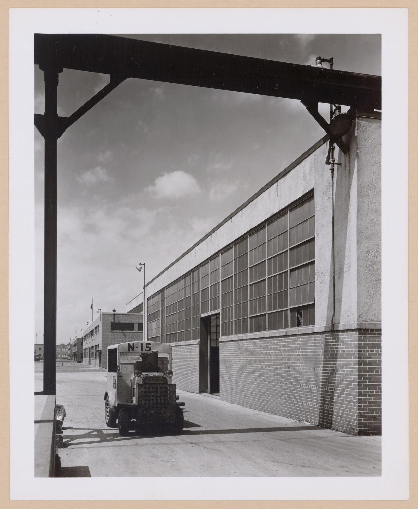 View of the principal façade of the Assembly Building (also known as Building No. 5) and the Machine Shops (also known as Building Nos. 2 and 3), United States Naval Ordnance Assembly Plant, Center Line, Michigan