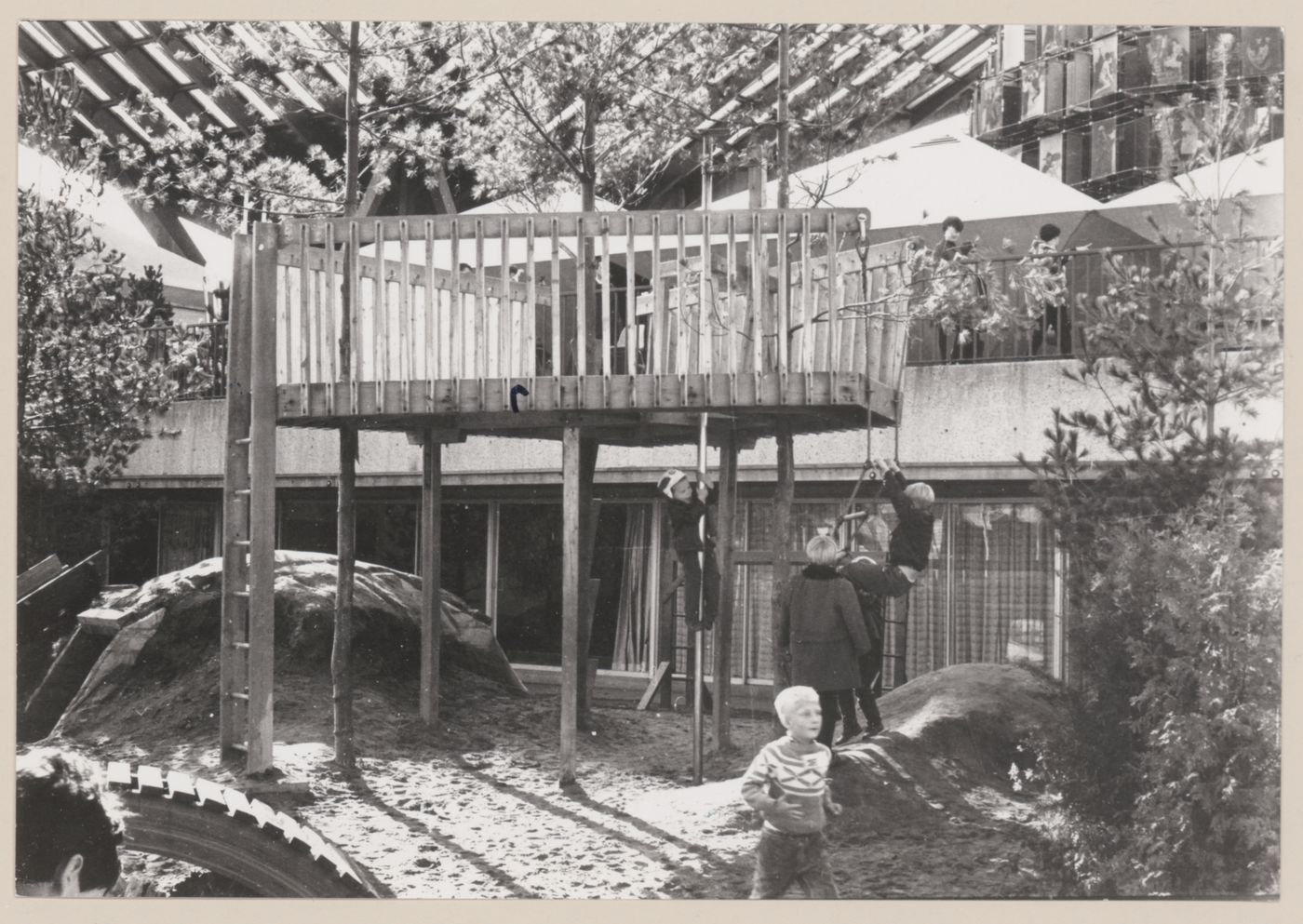 View of treehouse with mound and curved bridge in Children's Creative Centre Playground, Canadian Federal Pavilion, Expo '67, Montréal, Québec