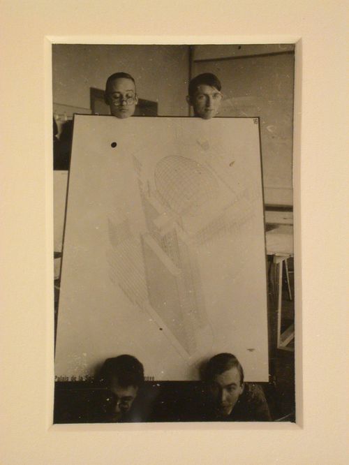 Portrait of Hannes Meyer, Aryeh Sharon and unidentified students at the Bauhaus in Dessau, Germany, holding a competition drawing by Hannes Meyer and Hans Wittwer for the League of Nations Building in Geneva, Switzerland