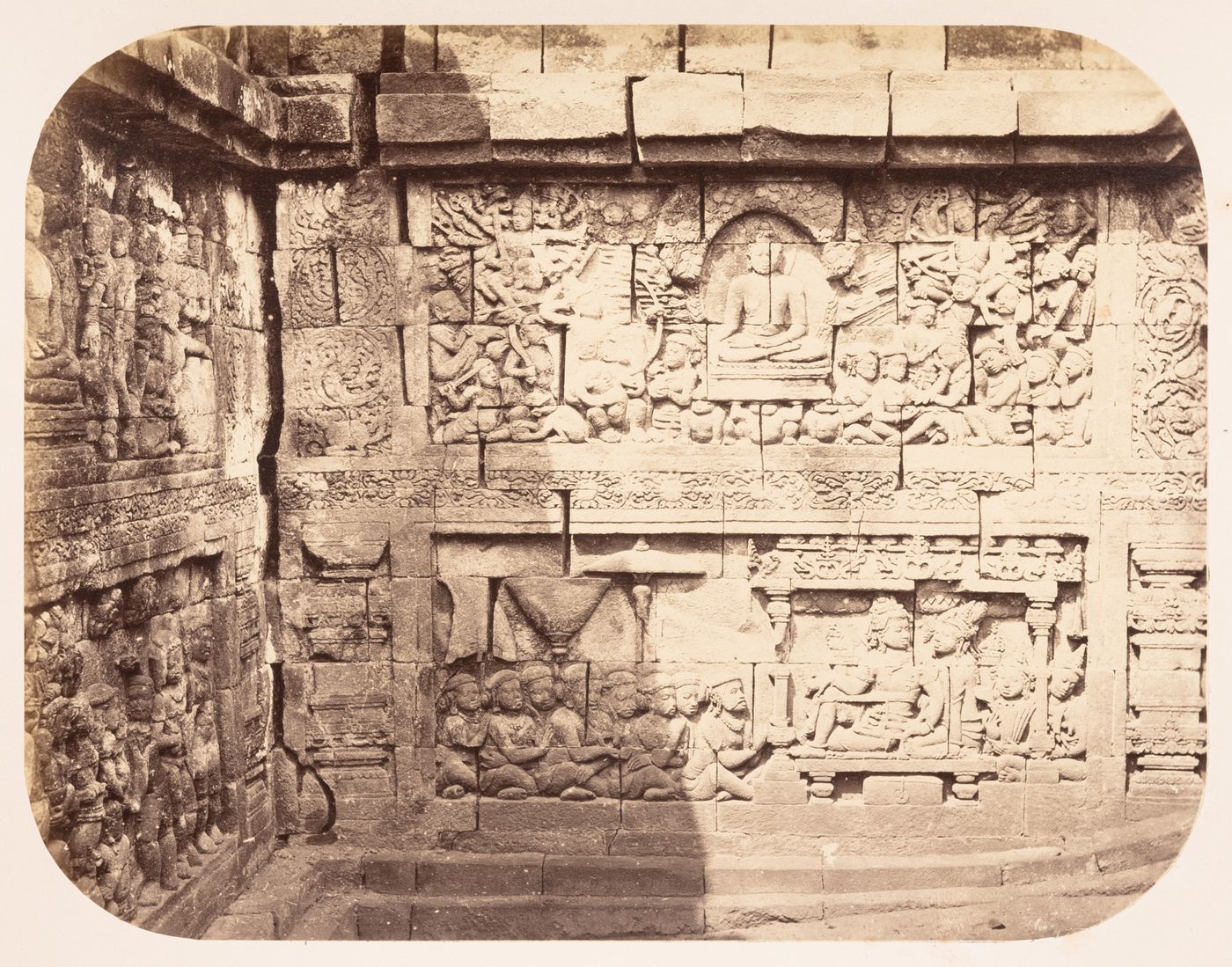 View of bas-reliefs and stone walls, Borobudur, Dutch East Indies (now Indonesia)