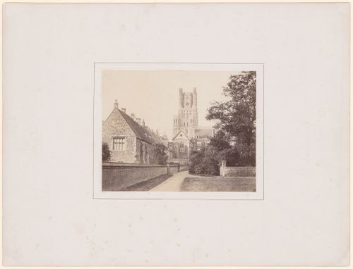 Distant view of Southwest transept tower of cathedral (from the South) with the Bishop's Palace in the foreground, at left, Ely, England