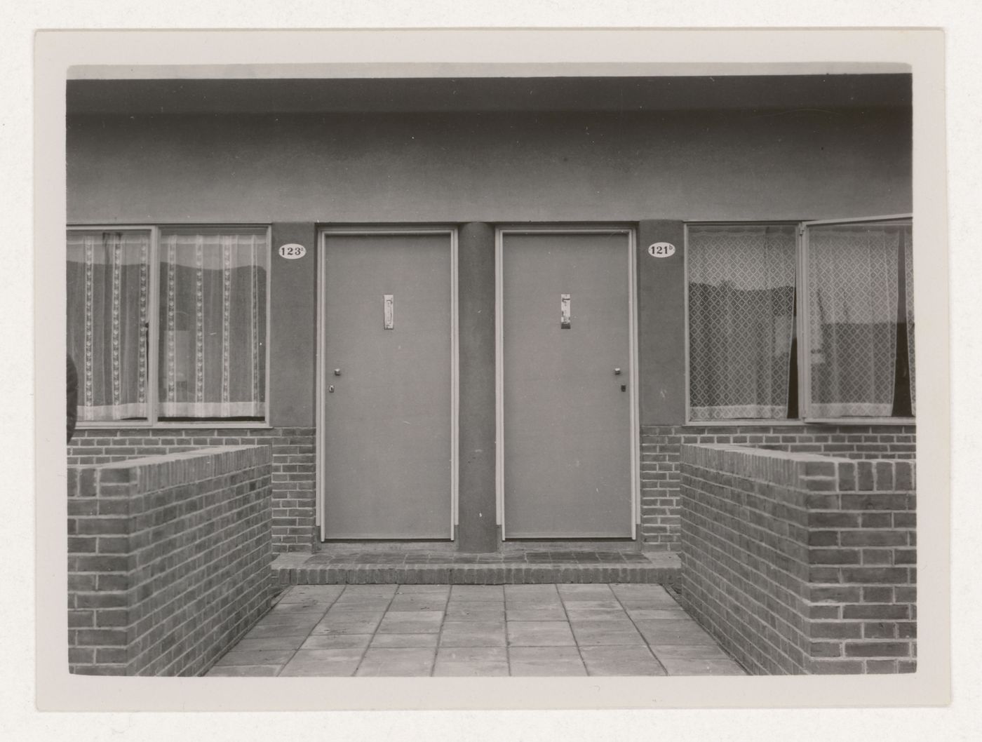 View of the entrances to two industrial row houses, Hoek van Holland, Netherlands