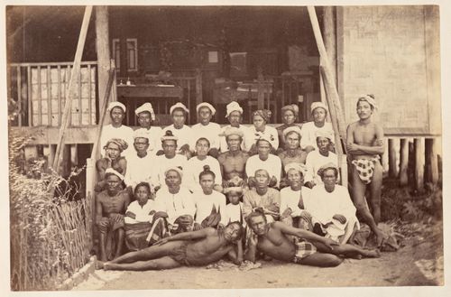 Group portrait of Burmese men on a staircase, Bassein, Burma (now Myanmar)