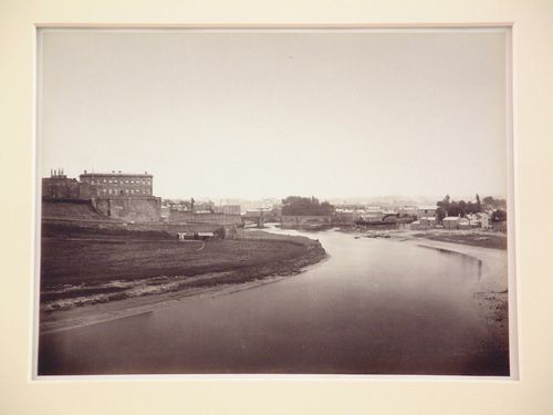 Distant view of Chester Castle, a bridge over the river Dee, and other buildings and houses, Chester, England