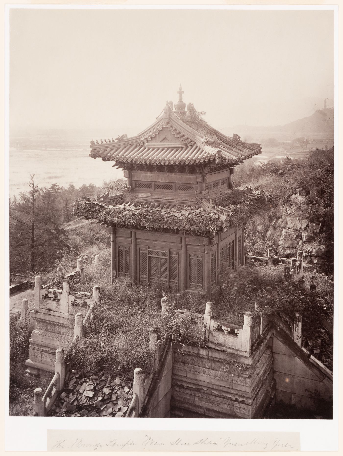 View of the ruins of the Pavilion of Precious Clouds [Baoyun Ge] (also known as the Bronze Pavilion), Garden of the Clear Ripples [Qing Yi Yuan] (now known as the Summer Palace or Yihe Yuan), Peking (now Beijing), China
