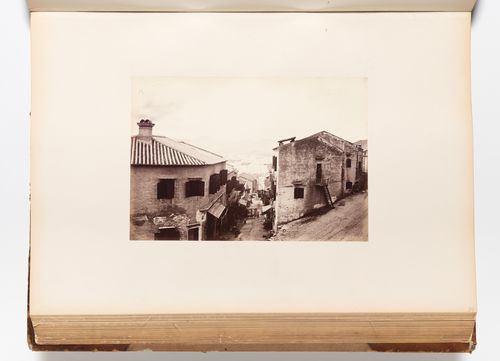 View of streets and buildings showing the harbour in the distance, Hong Kong (now Hong Kong, China)