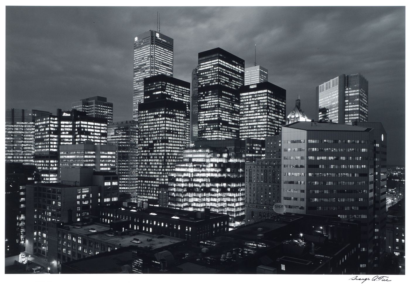 View of the banking district of Toronto at night showing the illuminated Commercial Union Tower, the Royal Trust Tower, the Toronto-Dominion Bank Tower and the IBM Tower