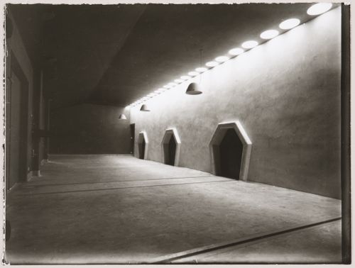 Interior view of the committal chamber showing doors and ceiling fixtures, Woodland Crematorium and Cemetery, Stockholm