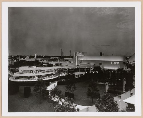 View of the Ford Motor Company pavilion at night showing a ramp and automobiles, 1939-1940 New York World's Fair, New York City, New York