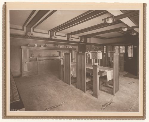 Interior view of Robie House showing the dining room with furniture designed by Frank Lloyd Wright and George M. Niedecken, Chicago, Illinois