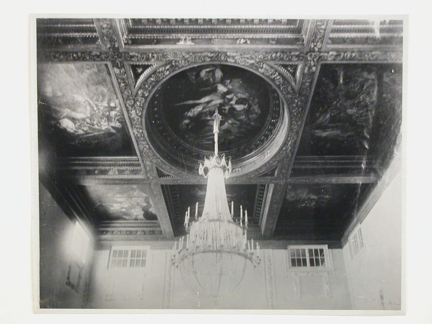 Interior view of the Tarasov Mansion showing a decorated compartment ceiling and a chandelier, Moscow