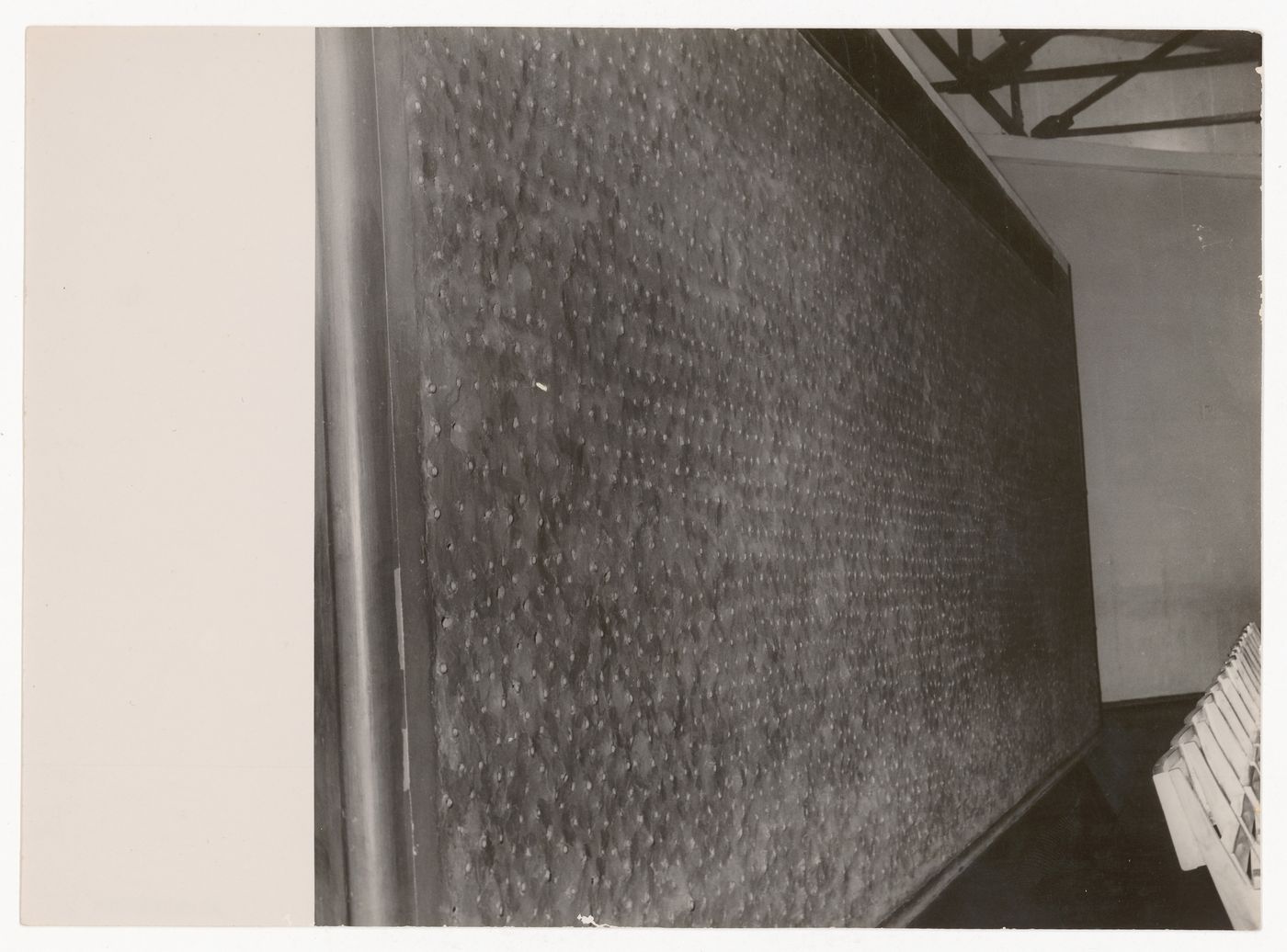 Photograph of the perforated acoustic pannelled wall for Tagore Theatre project, Chandigarh, India