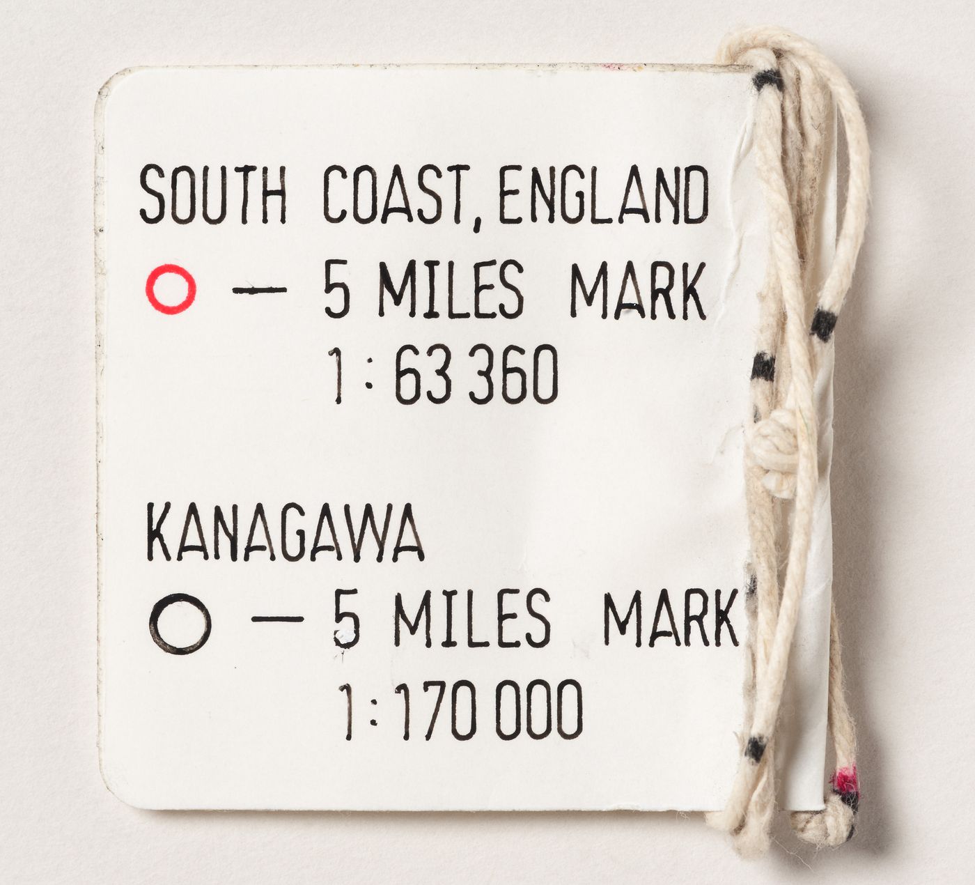 SURF 90: length of string with label for "5 miles mark" for the South Coast of England and for Kanagawa, Japan