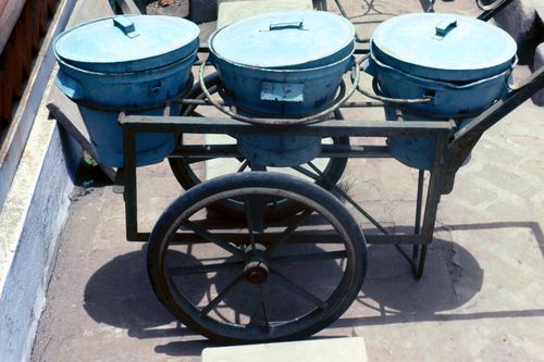 View of buckets on a cart for pour-flush sanitation system for the Human Settlement Training Package "Package 5: Low-cost Technologies: Pour-Flush Sanitation System"