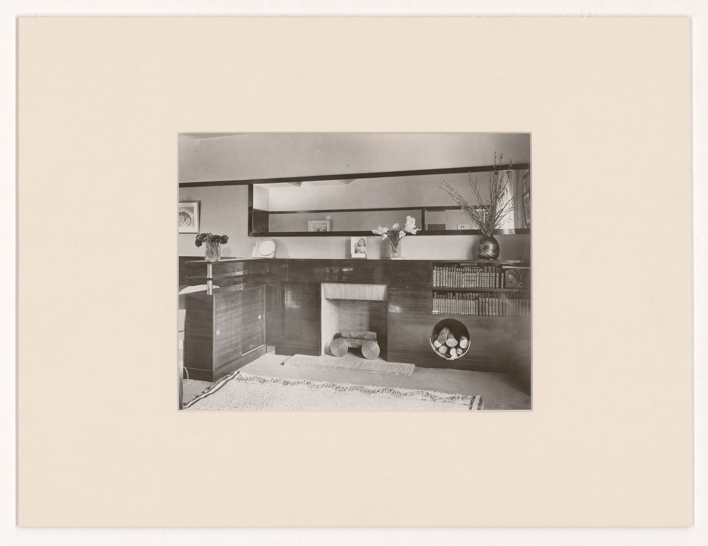 Interior view of a living room in an unidentified apartment, showing fireplace