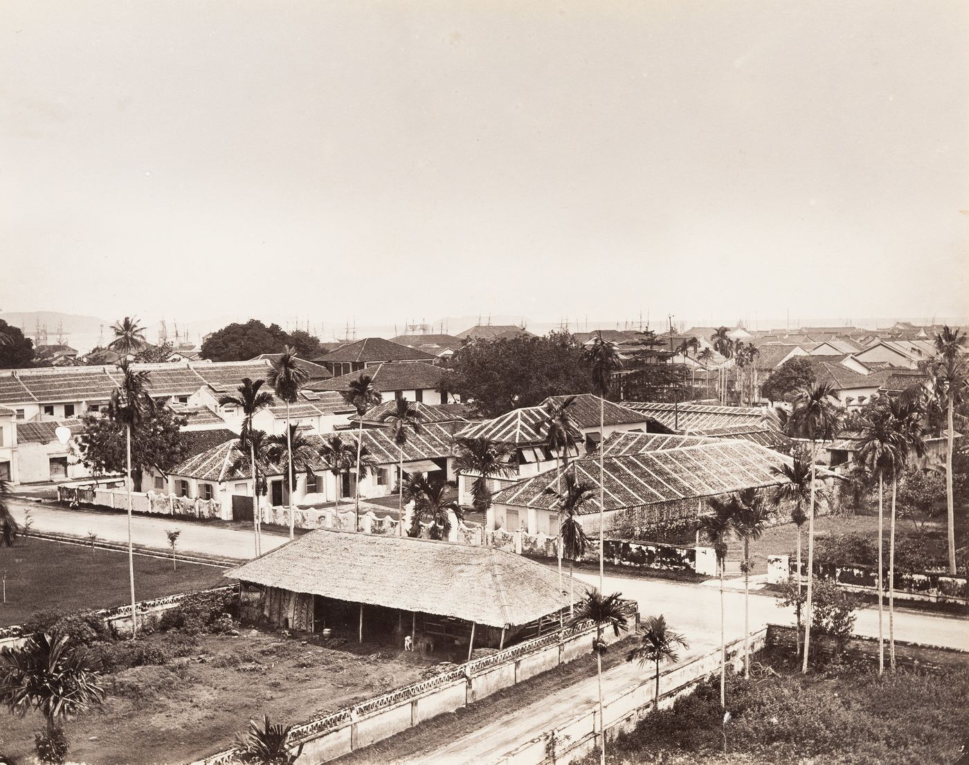 View of houses, rooftops and harbor of Penang (now Pinang, Malaysia)