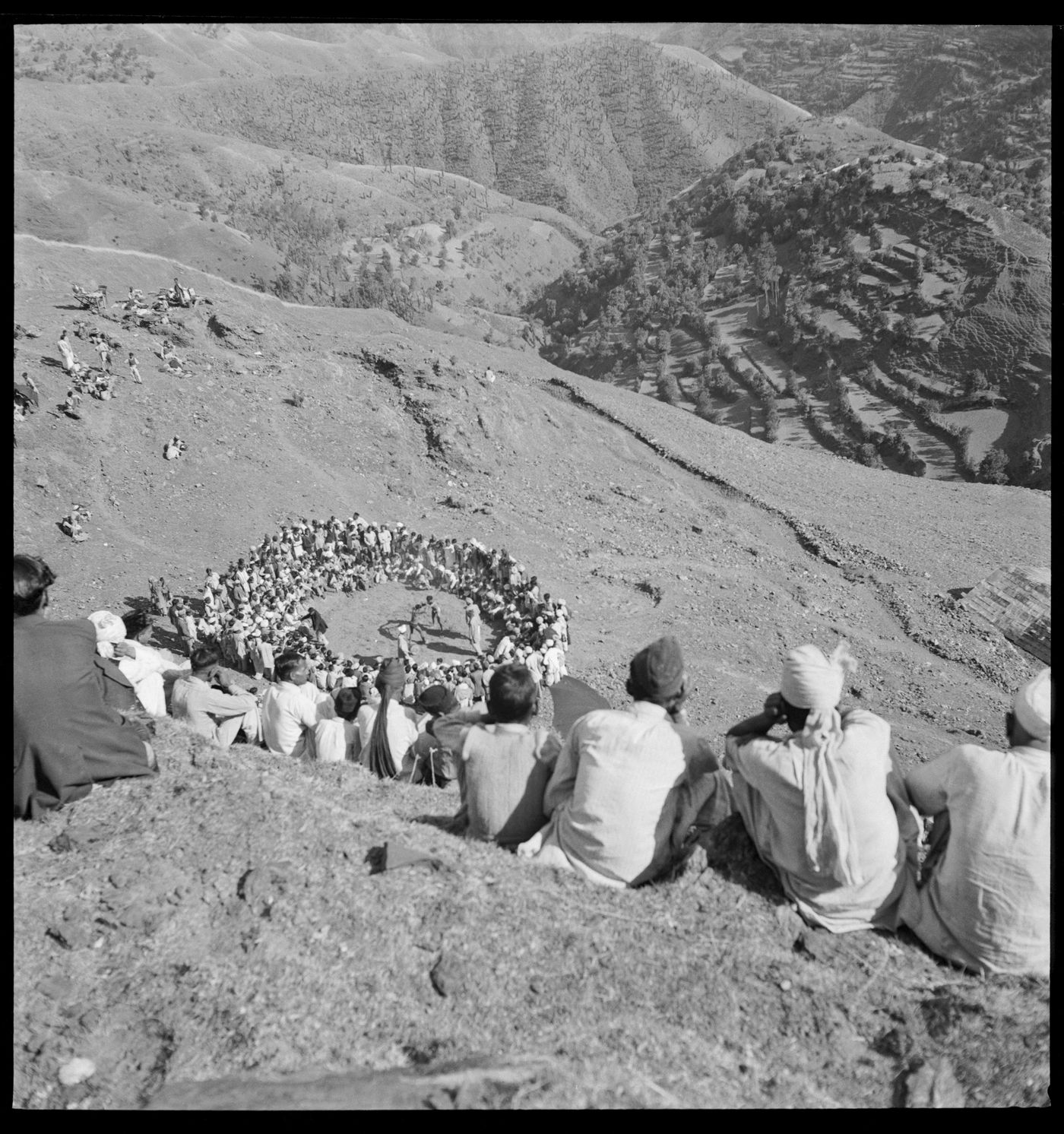 Crowd watching a wrestling match in Chandigarh's area before the construction, India