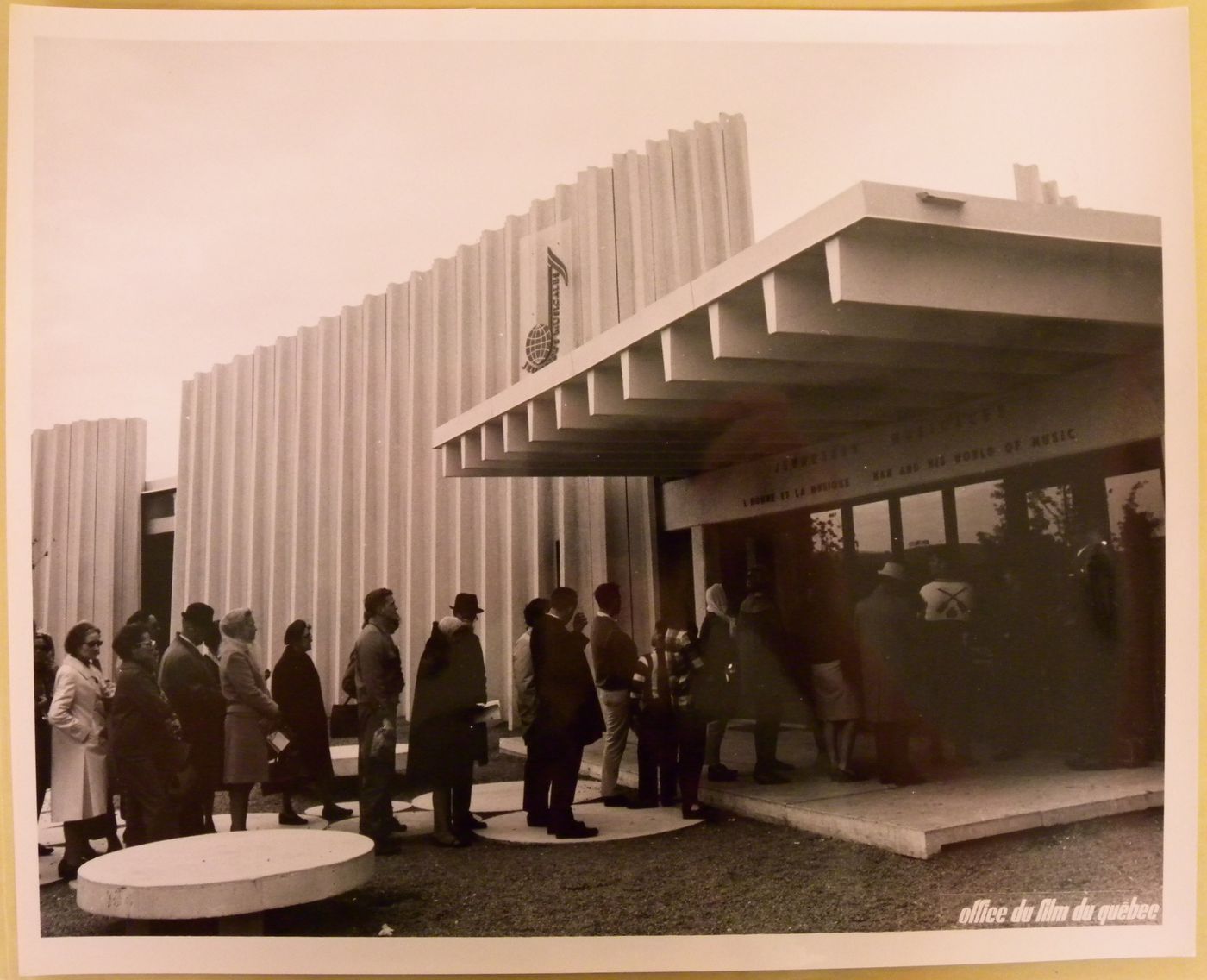 View of visitors standing in line at the Pavilion of the Jeunesses Musicales of Canada, Expo 67, Montréal, Québec