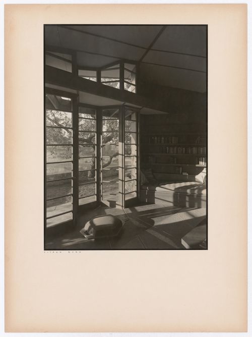 Interior view of the Hanna House showing a doorway, windows, and seating furniture, Palo Alto, California, United States