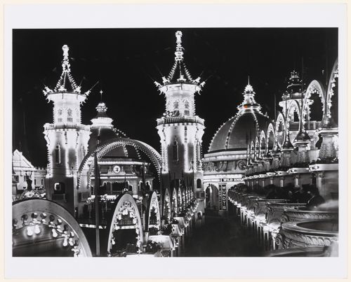 Luna Park: Buildings and open balconies with people, lit with bulbs, at night, Coney Island, Brooklyn, New York City, New York