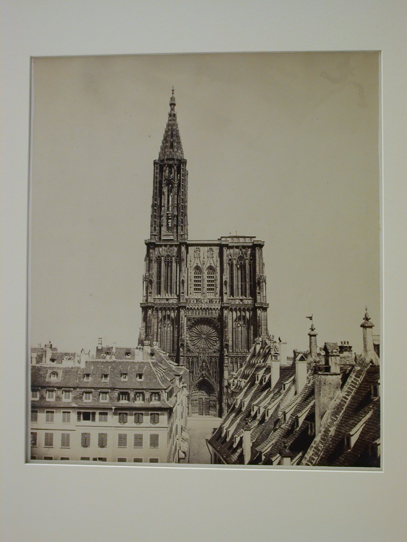 View of façade and tower of Strasbourg Cathedral, with houses in foreground, Strasbourg, France