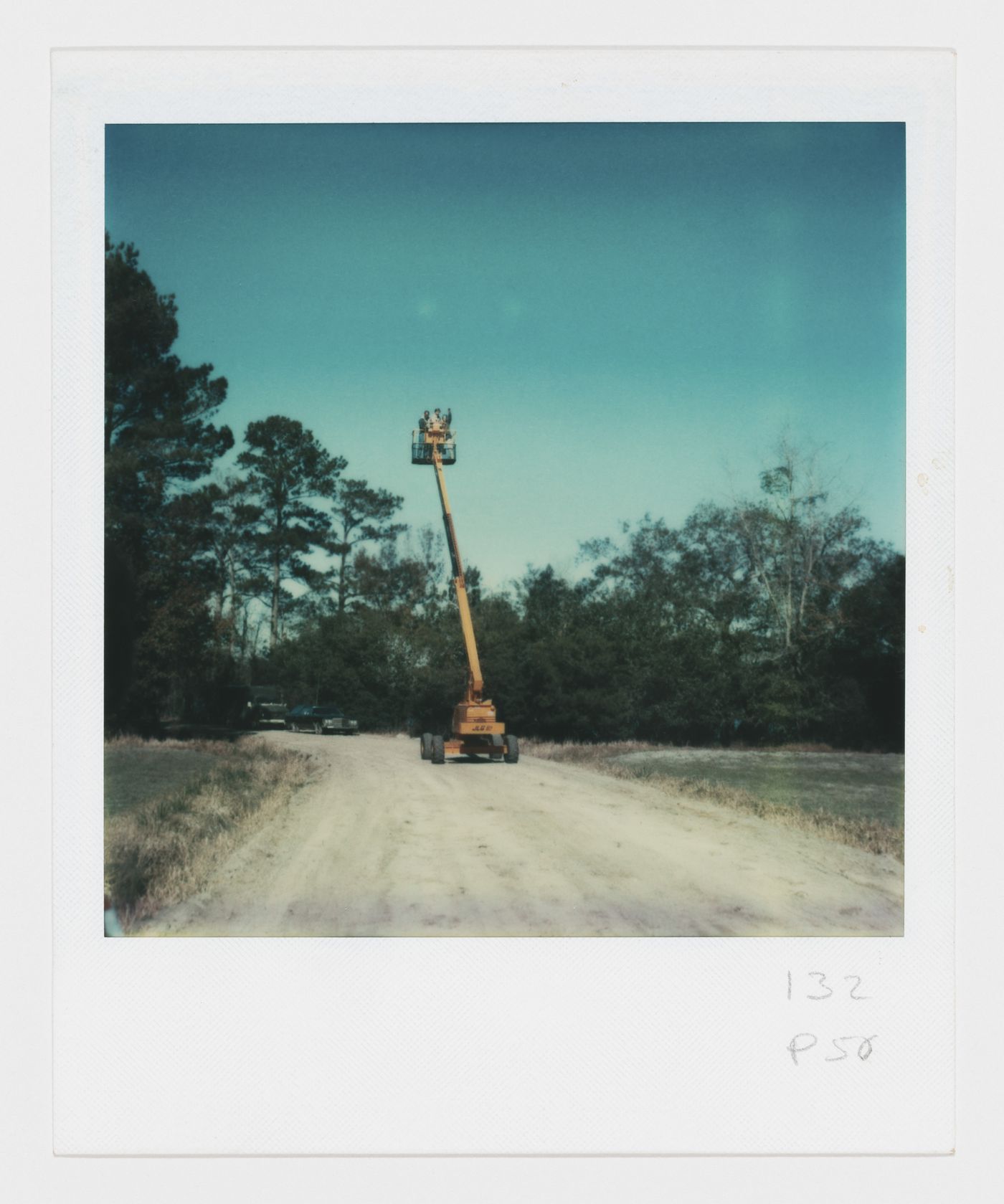 Generator project, White Oak Plantation, Yulee, Florida: portrait of group in crane basket
