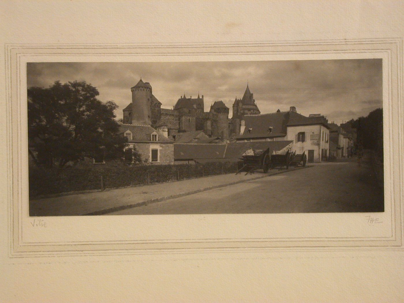 Street scene with houses and church, Vitré, France