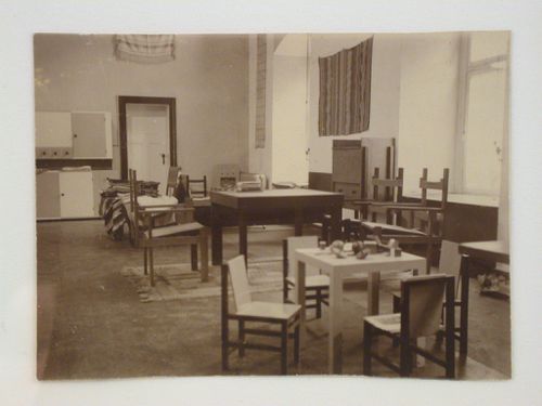 Interior view of the Bauhaus Exhibition of 1923 in Weimar showing tables and chairs, Germany