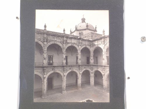 Partial view of the patio and cloister of the Convento de San Agustín with the dome of the Church of San Agustín de Querétaro in the background, Querétaro, Mexico